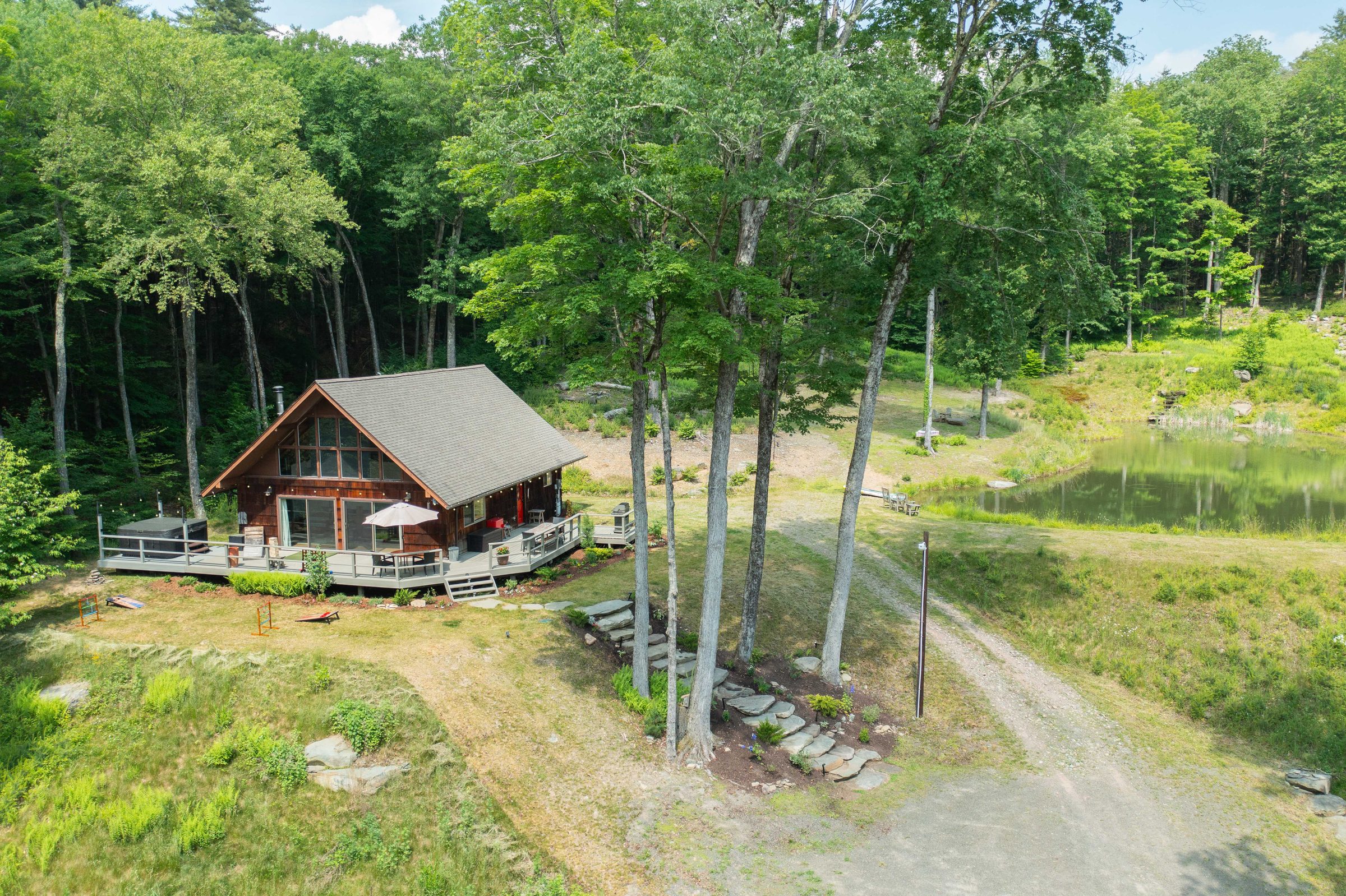 A-frame cedar chalet at The Catskill Oasis surrounded by pines